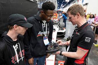 Haas representative showing students F1 equipment. 